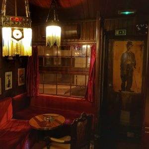 A Parodia cocktail bar in Lisbon, an old school speakeasy entirely decorated with creations by Rafael Bordalo Pinheiro