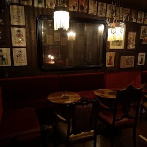 A Parodia cocktail bar in Lisbon, an old school speakeasy entirely decorated with creations by Rafael Bordalo Pinheiro