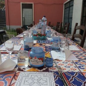 Painting a tile during an azulejos workshop in Lisbon