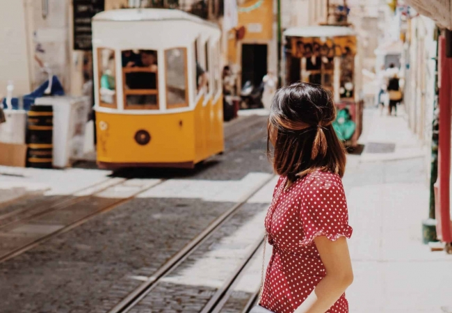 Young erasmus student exploring the unusual streets of bairro alto and bica