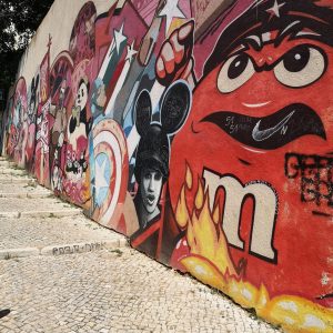 Street art in Graça by Pariz One and Mr. Dheo paying tribute to the Carnation Revolution