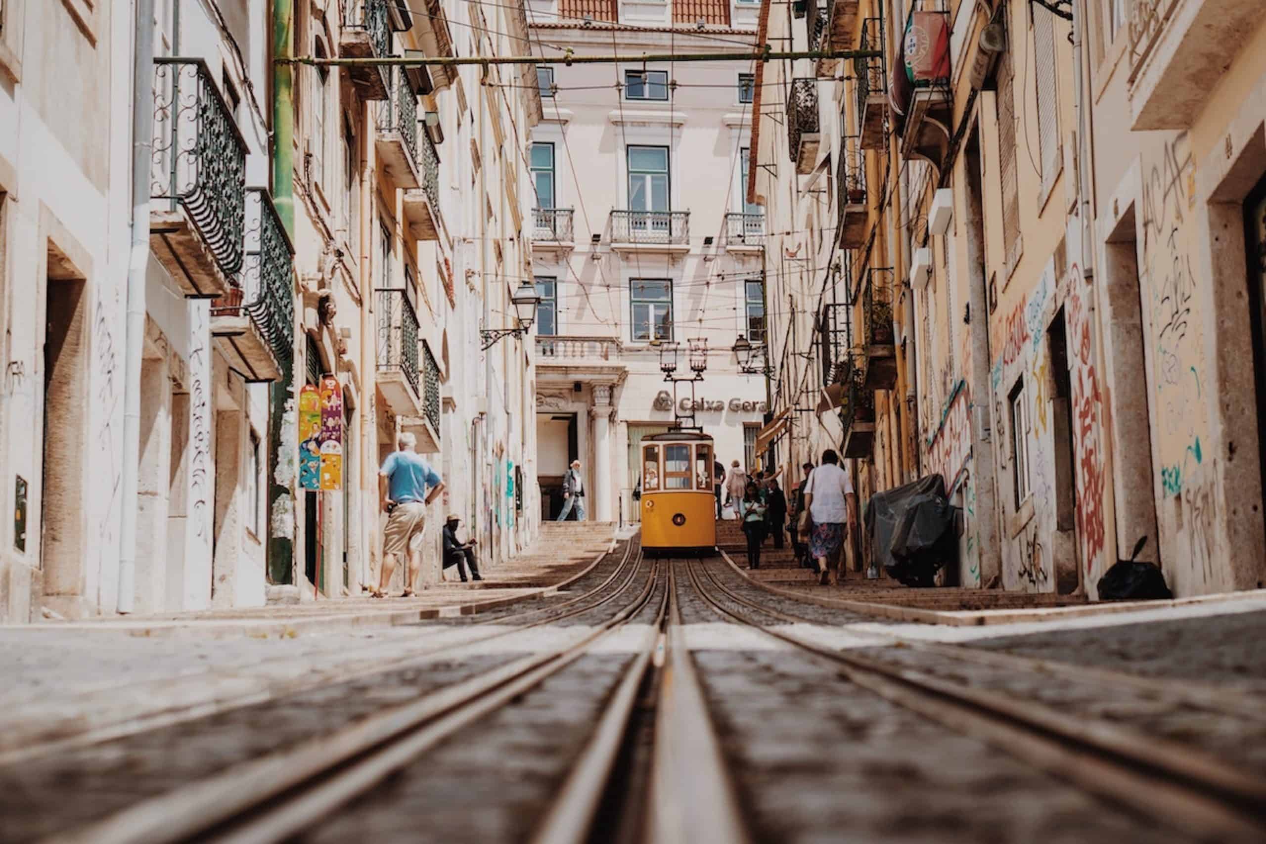 Historic tram riding through Lisbon streets