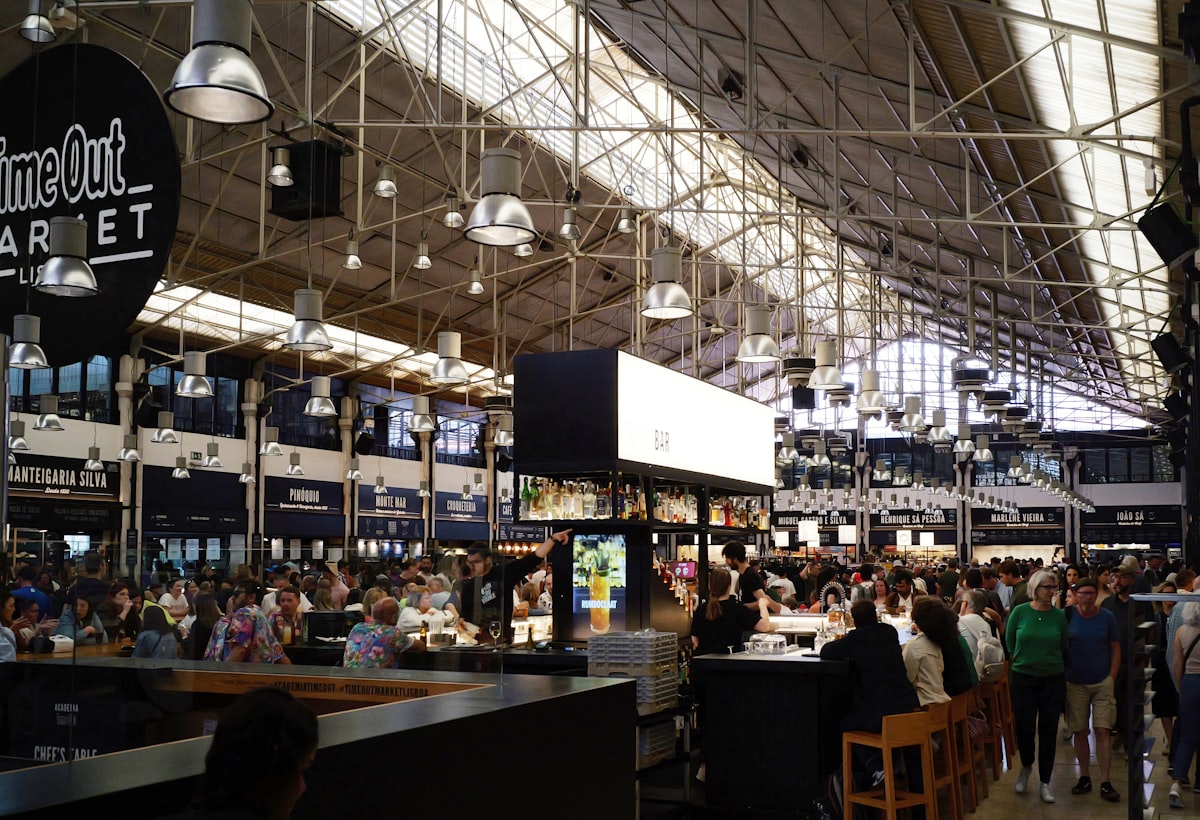 Time Out Market Lisbon food hall with crowds and food stalls